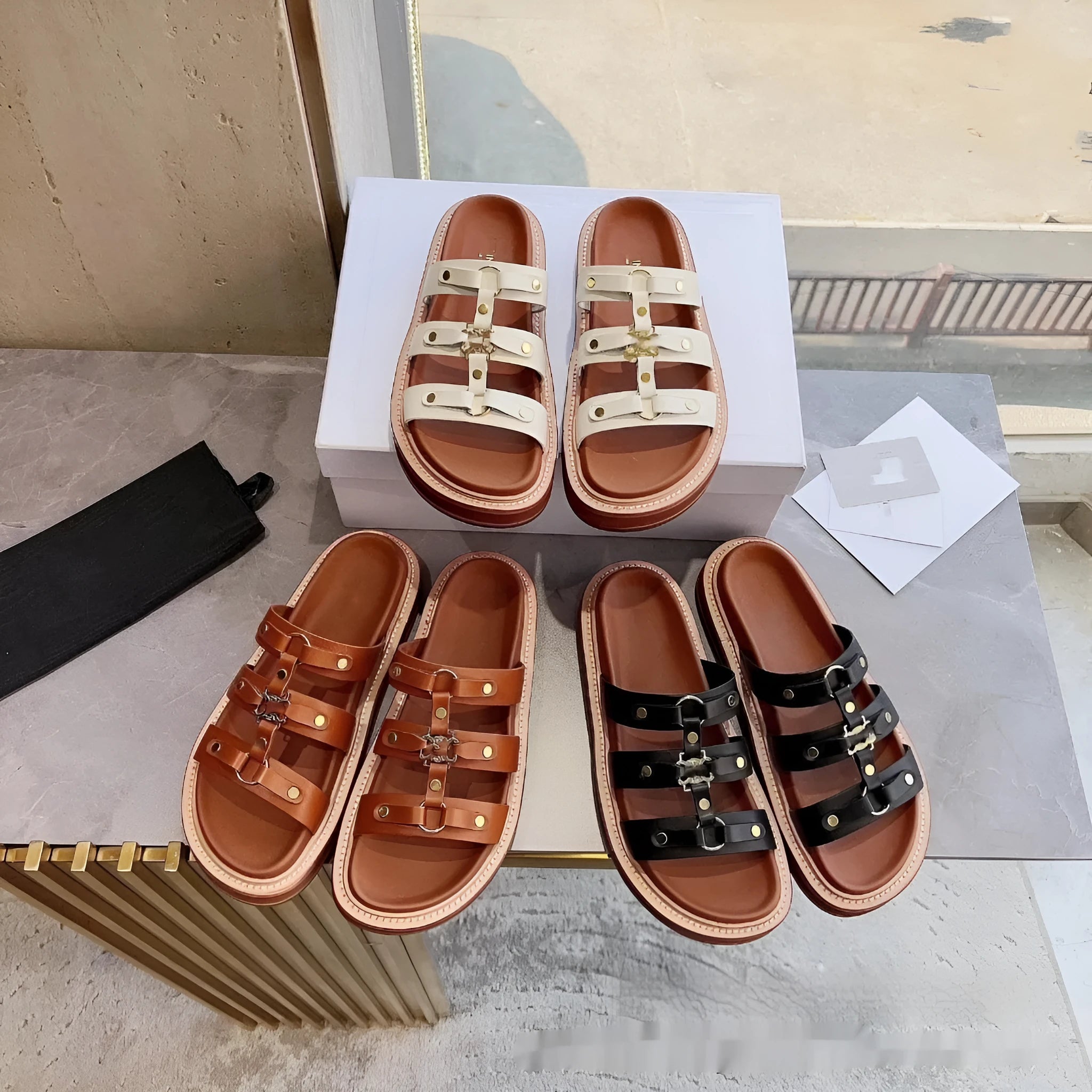 Women's black retro Roman gladiator sandal slippers made from patent leather and sheepskin.