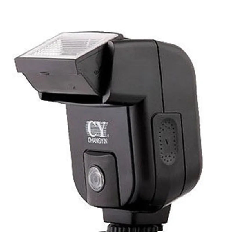 Compact black SLR camera flash with tilted head mounted on a DSLR camera hot shoe.