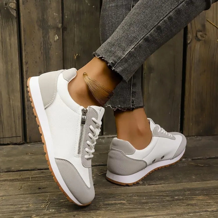 Women's flat-heeled shoes in artificial PU upper with rubber sole, shown in grey colour