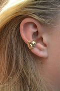Gold tone women's earrings with starfish and conch shell design