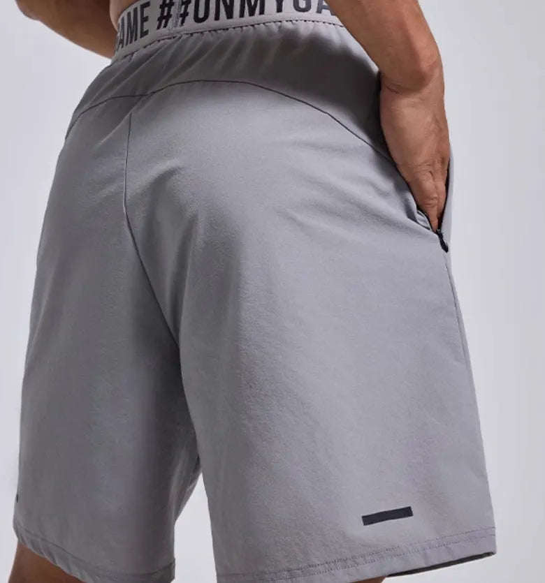 Men's loose sports shorts in black with letter detailing and elastic fly opening