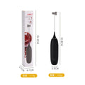 Black and white handheld electric milk frother with whisk attachment for coffee drinks