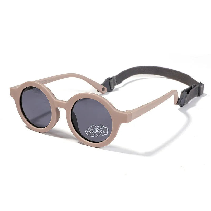 Soft silicone round-frame sunglasses for babies and toddlers aged 0-3 years with polarised UV400 lenses.