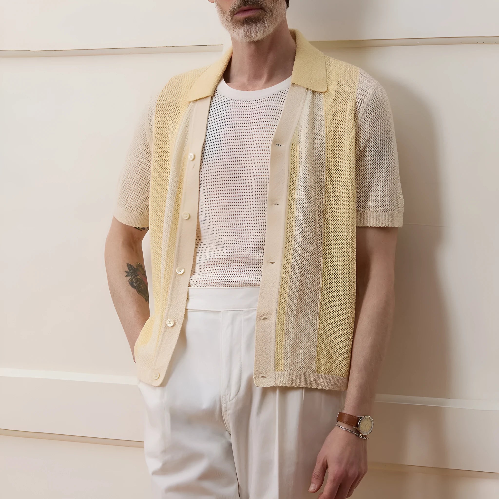 Yellow asymmetric casual polo shirt with hollow-out detail and short sleeves, made from Tencel fabric.