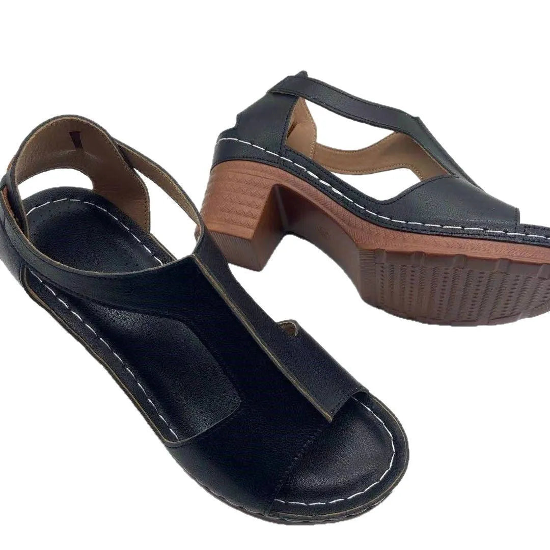 Women's beige peep toe wedge sandals with a Roman-style buckle strap on a low heel.