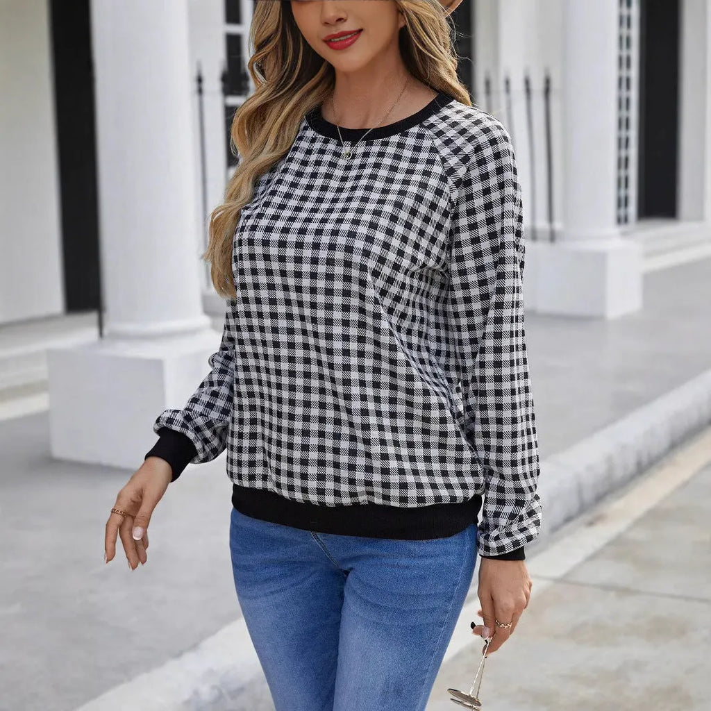 Black long sleeve pullover sweater with a Japanese plaid pattern, shown on a hanger.