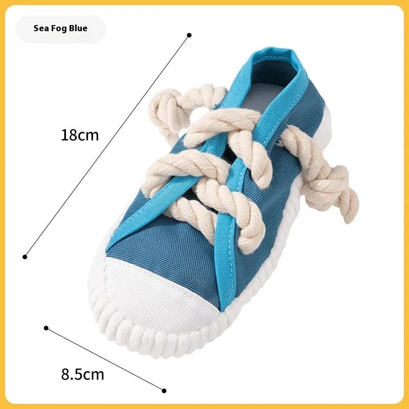 Plastic dog chew toy with sound squeaker in bendable slipper design for dental care