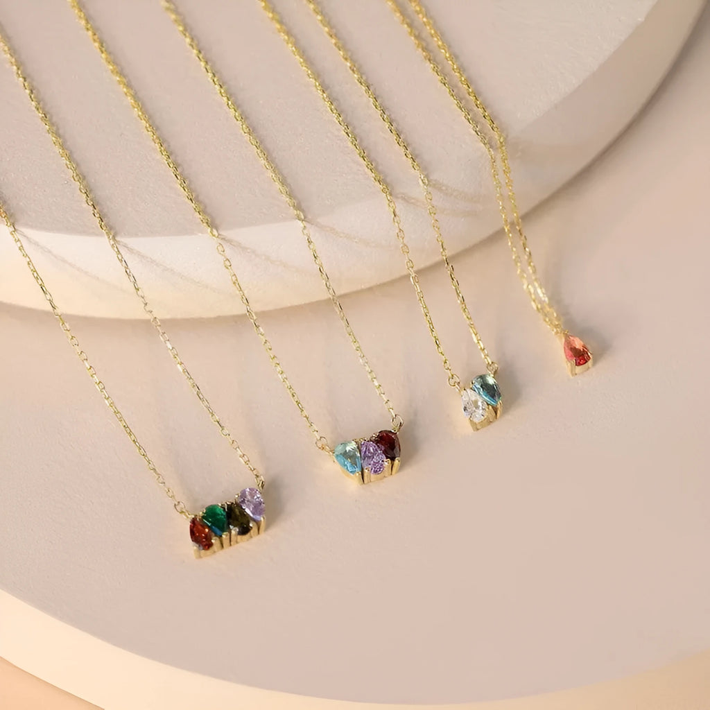 Zircon birthstone pendant on a titanium steel clavicle chain in silver, gold, or rose gold finish.