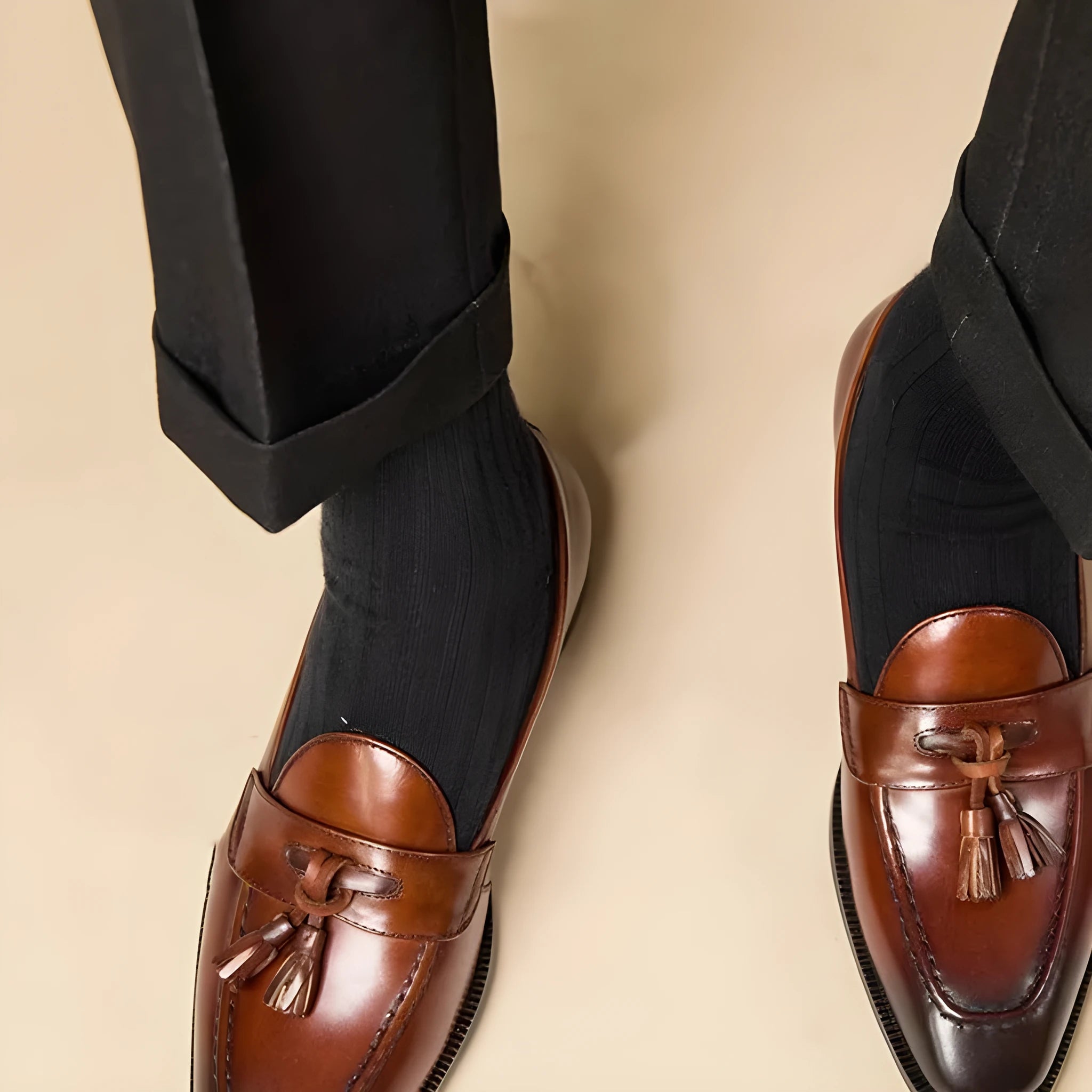 Men's polished leather tassel loafers in black and coffee colours with traditional British styling