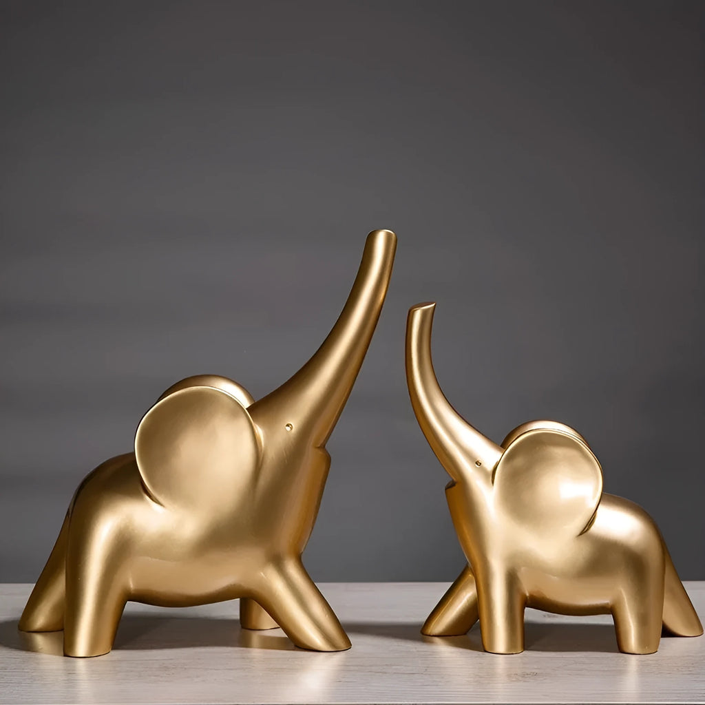 Rose gold and white resin elephant ornaments in large and small sizes displayed singly and as pairs