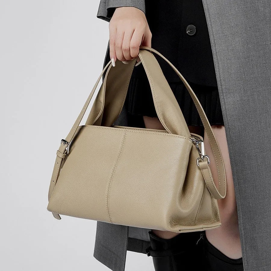 Genuine cowhide messenger bag in horizontal square shape with double shoulder straps and retro texture