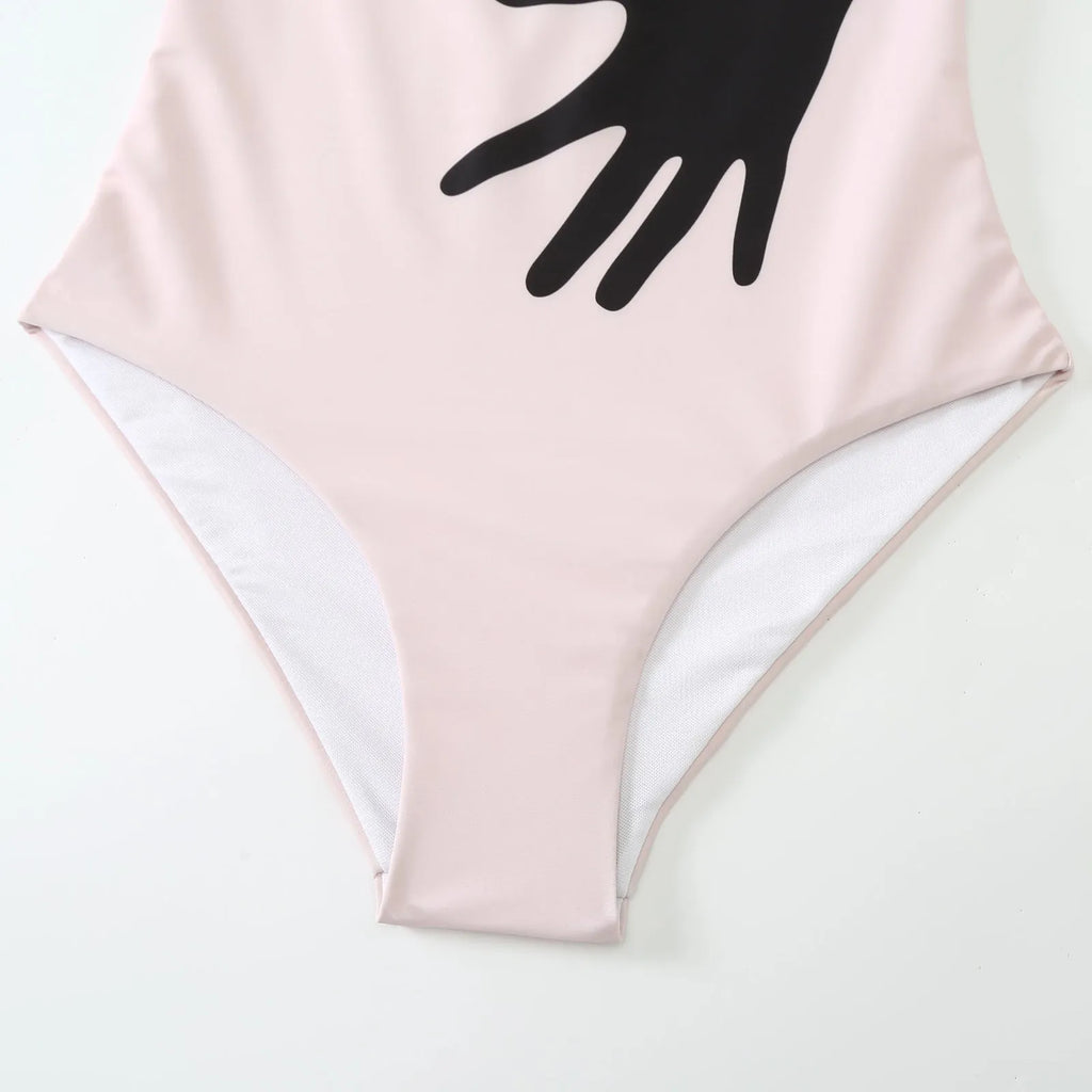 Women's patterned bikini swimsuit with a flowing white tulle skirt attached.