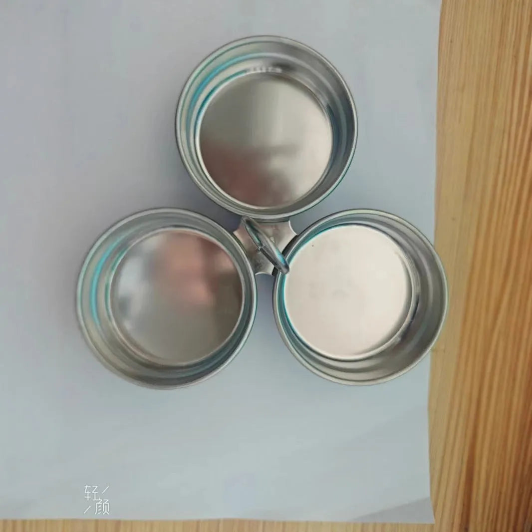 A mini stainless steel egg steamer shown in both round and heart-shaped design variations.