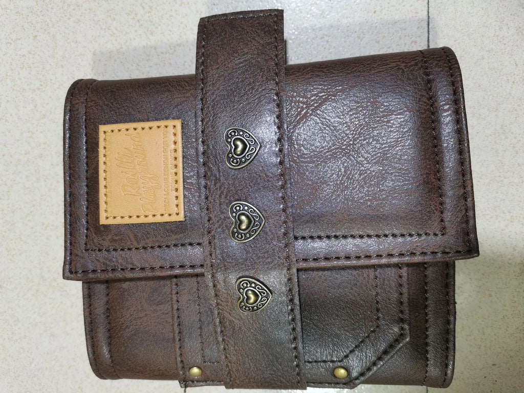 Brown retro-style notebook with leather buckle on PU cover, showing loose-leaf binder binding and A7 size