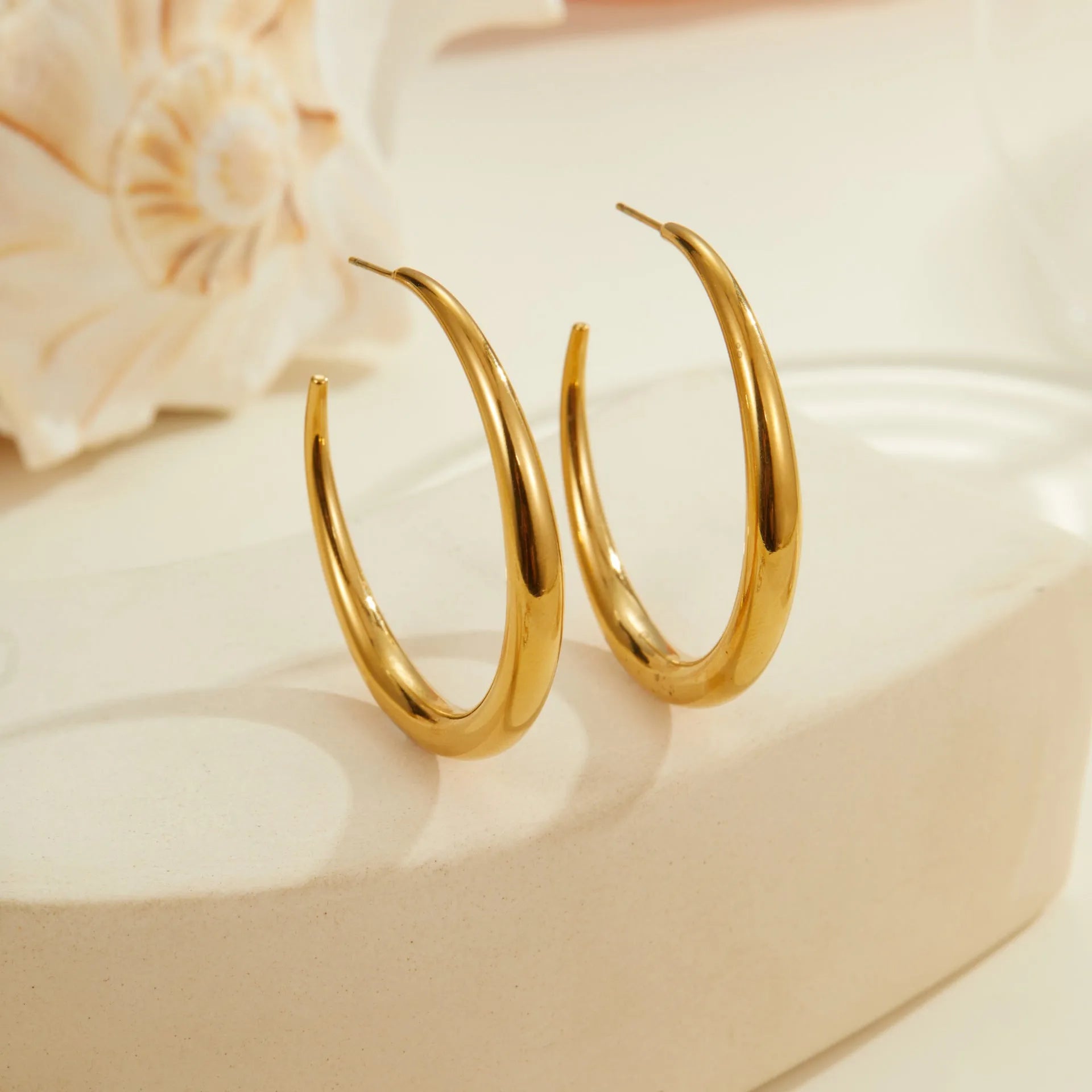 Titanium steel geometric round hoop earrings with gold plating in large and small size options