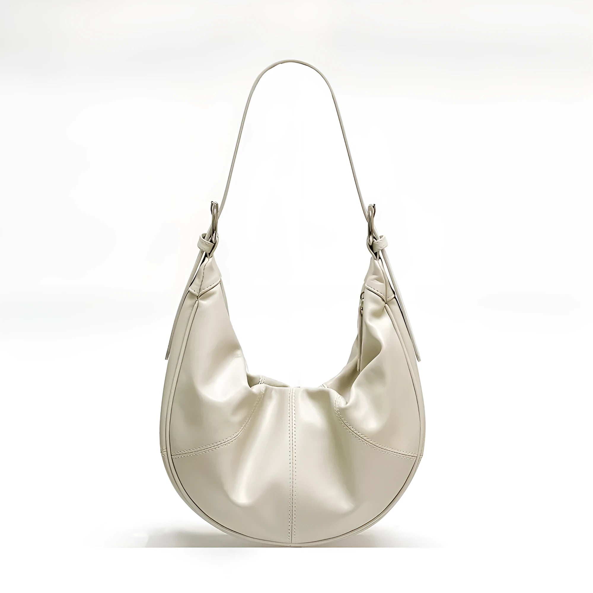 Women's soft cowhide leather shoulder bag in dumpling shape showing double straps and sandwich pocket.