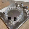 Glass butterfly bracelet for women with drop shape design and coloured glaze beads in moonlight grey