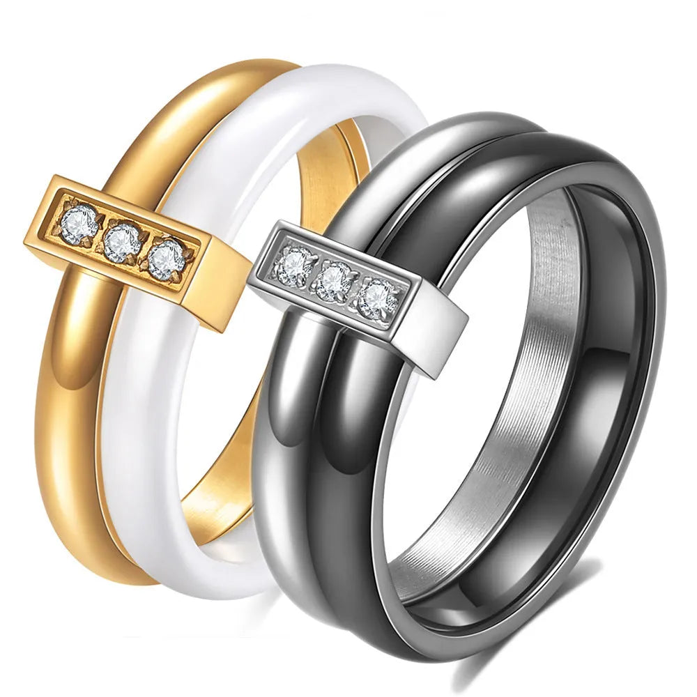 Ceramic ring with glossy stitching and inlaid zirconium in steel black or gold white colour, 6mm geometric shape