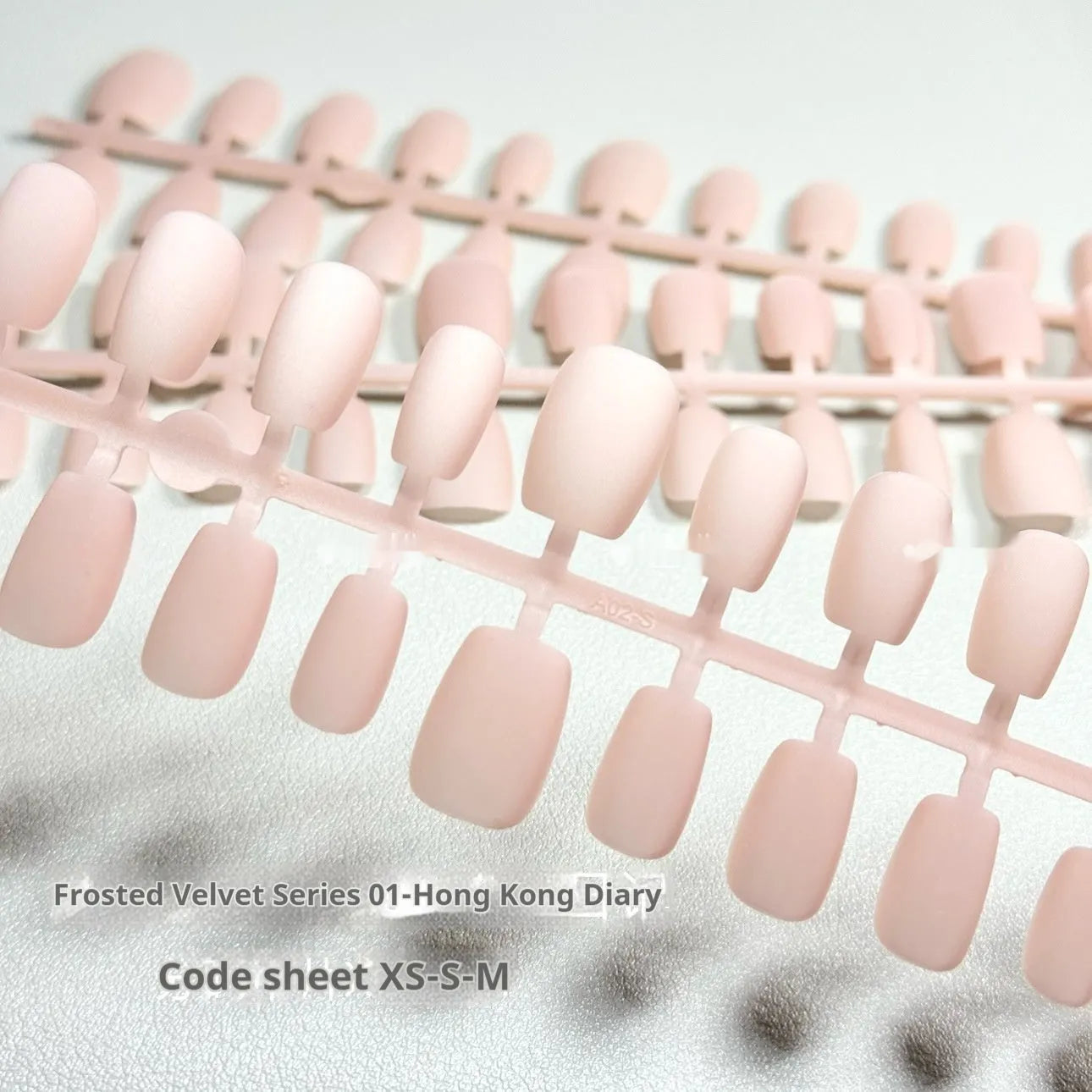 Frosted Velvet Cat's Eye false nail set showing electroplated design on short ladder sized PVC nails