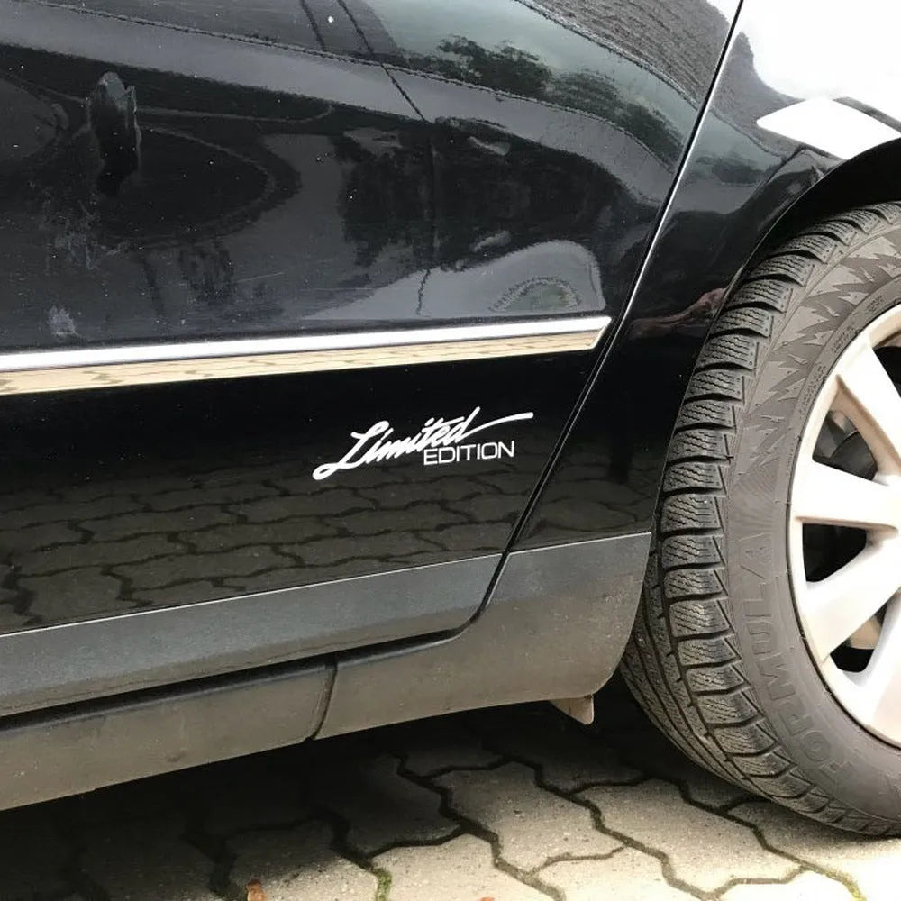 Close-up of a reflective plastic bumper sticker showing British style text, measuring 16cm long.