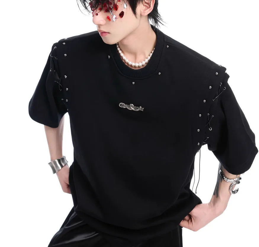 Black deconstructed lace-up cutout short sleeve t-shirt on a hanger