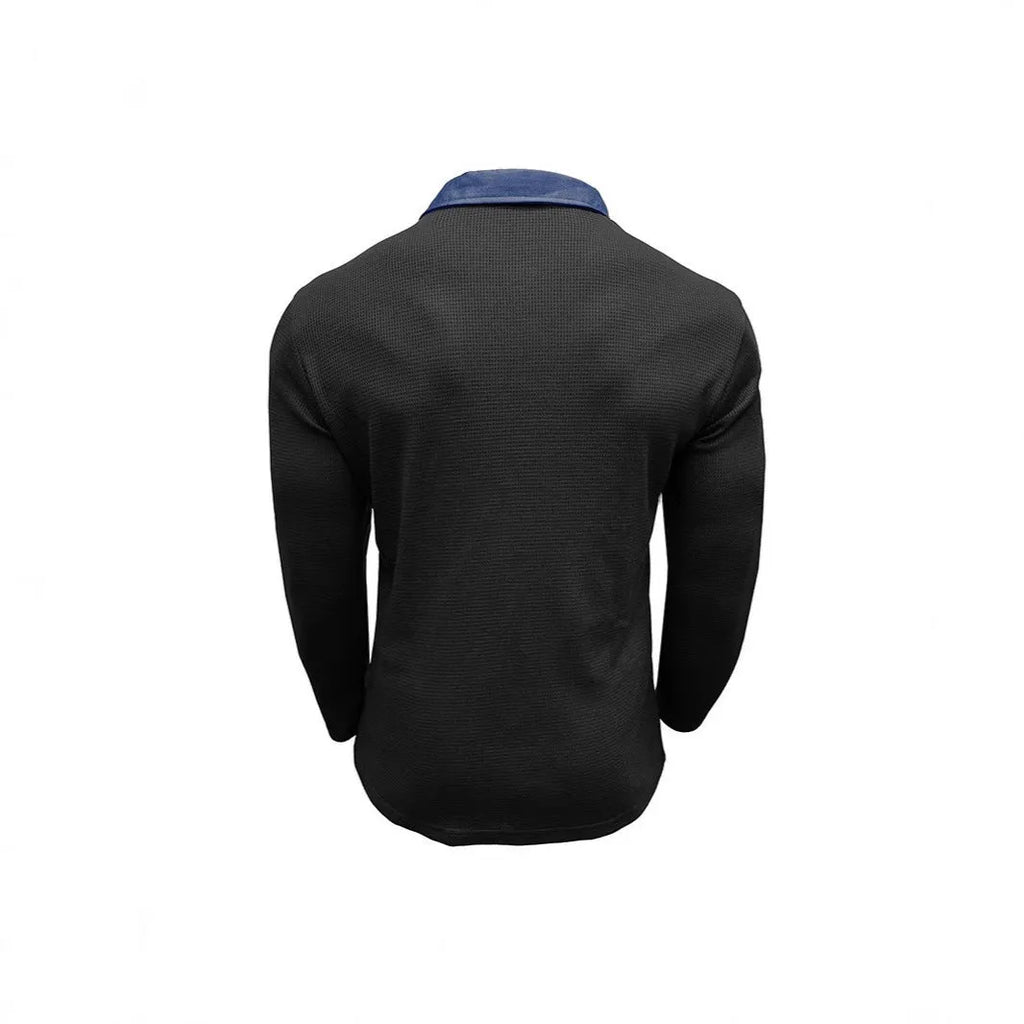 Man wearing a long-sleeved waffle knit polo shirt in a loose, retro style.