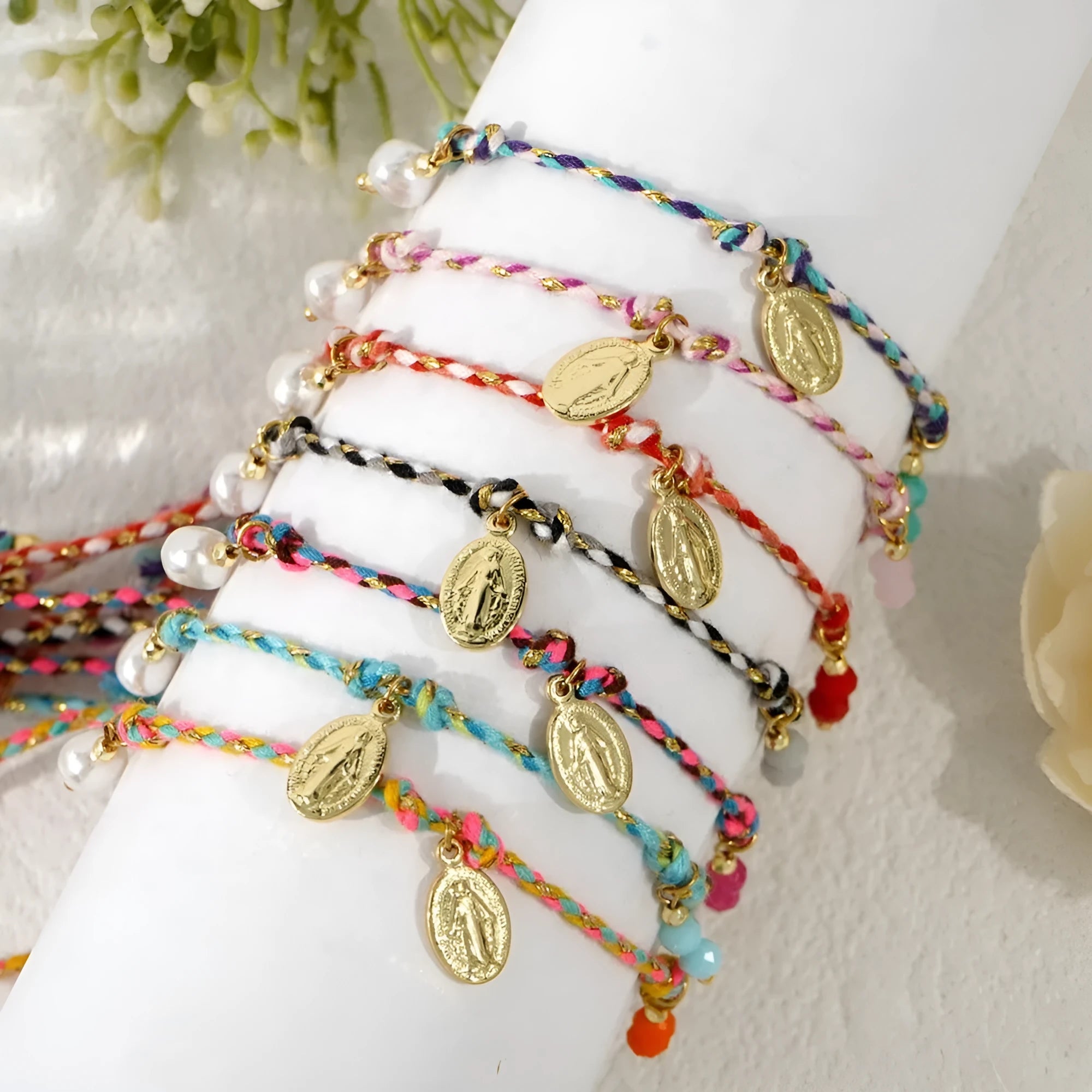 Hand-woven ethnic style bracelet made from colourful braided rope with carrying strap detail