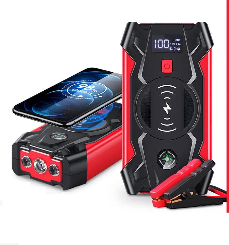 Red portable car emergency jump starter with digital display and thick clamps for 12V vehicle battery rescue