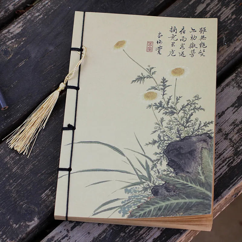 A5 antique wire-bound notebook with retro painting cover, thread binding, and black tassels.