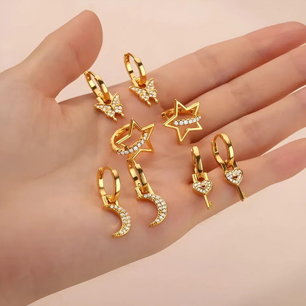 Women's geometric butterfly-shaped copper earrings with heart and star details in assorted colours.
