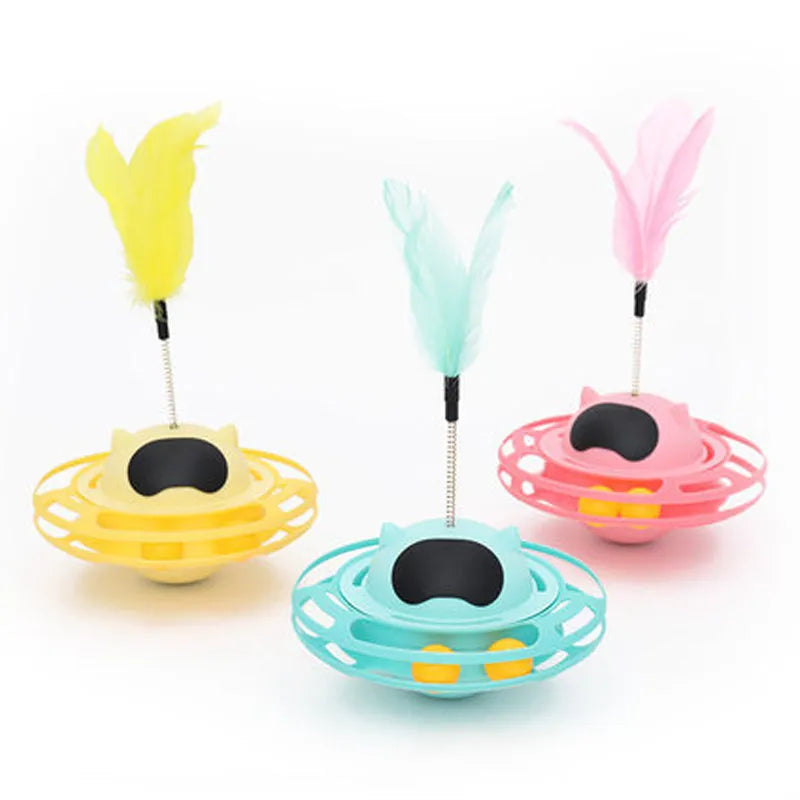 Pink plastic cat tumbler turntable toy with colourful balls measuring 17x10cm
