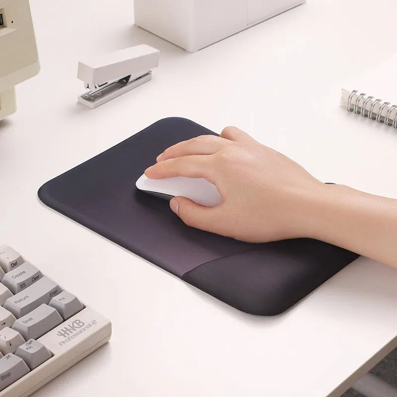 Square silicone gel wrister mouse pad with wrist strap on cloth surface measuring 250mm by 180mm