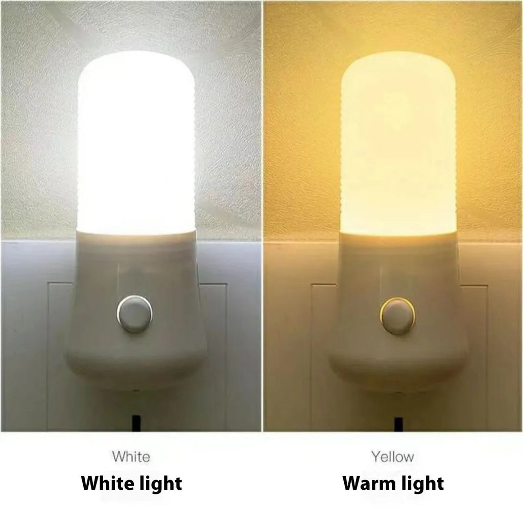 Compact square white minimalist plug-in bedside night light on a surface.