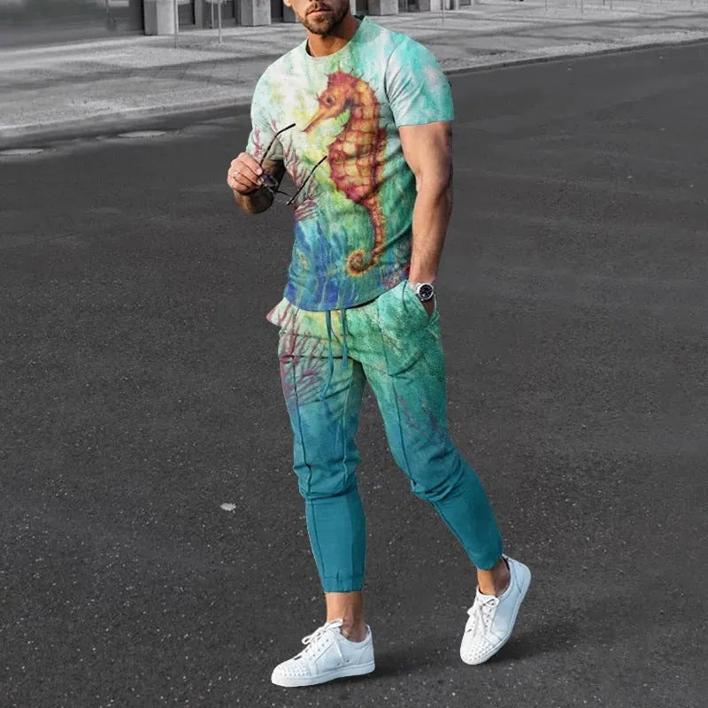 Men's grey printed short-sleeved tracksuit top and trousers laid flat.