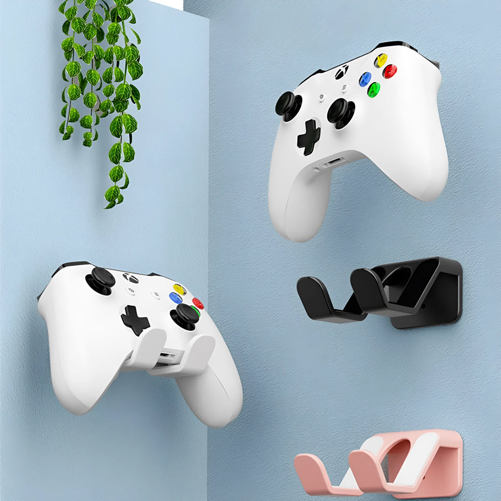 Black universal plastic wall hanger for game controllers with adhesive mounting and bracket upholstery.