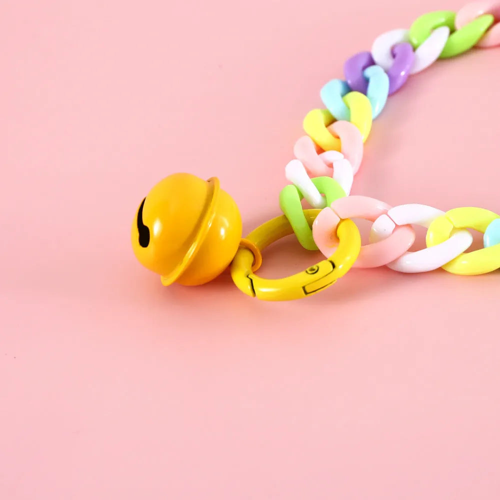 Adjustable plastic pet collar in macaron candy colours on a white background.