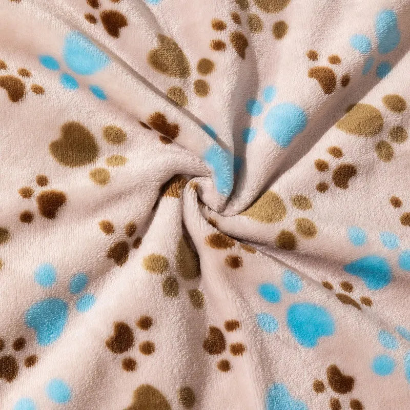 Blue cartoon dog pattern on a thick flannel pet blanket laid flat, showing its size as a dog kennel mat.