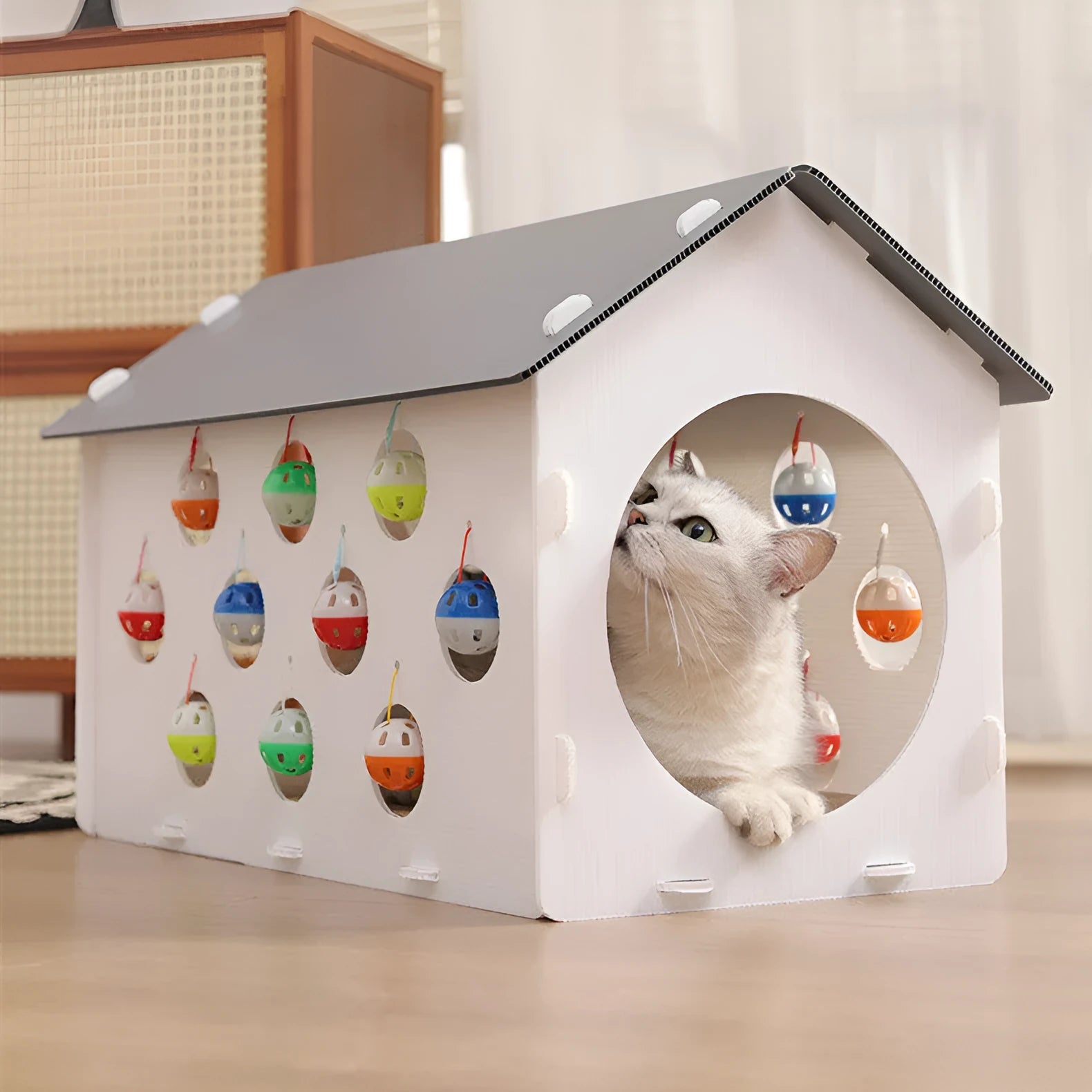 Integrated cat scratch board with nest featuring bell ball toy and plastic tunnel construction