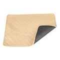 Grey and khaki washable waterproof dog pee pads on a wooden floor.