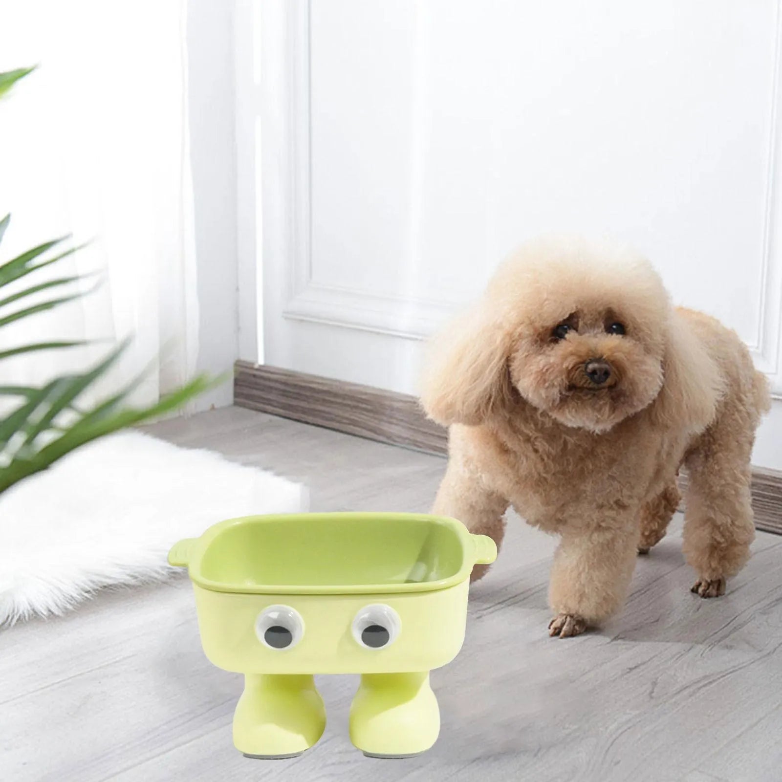 Green elevated cat bowl with cartoon robot design and 15° tilt angle