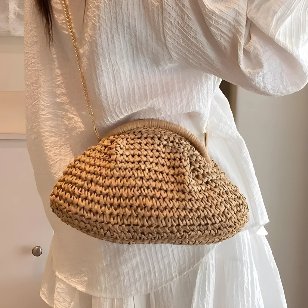 Shell-shaped straw beach bag with chain strap in khaki colour showing zippered pocket