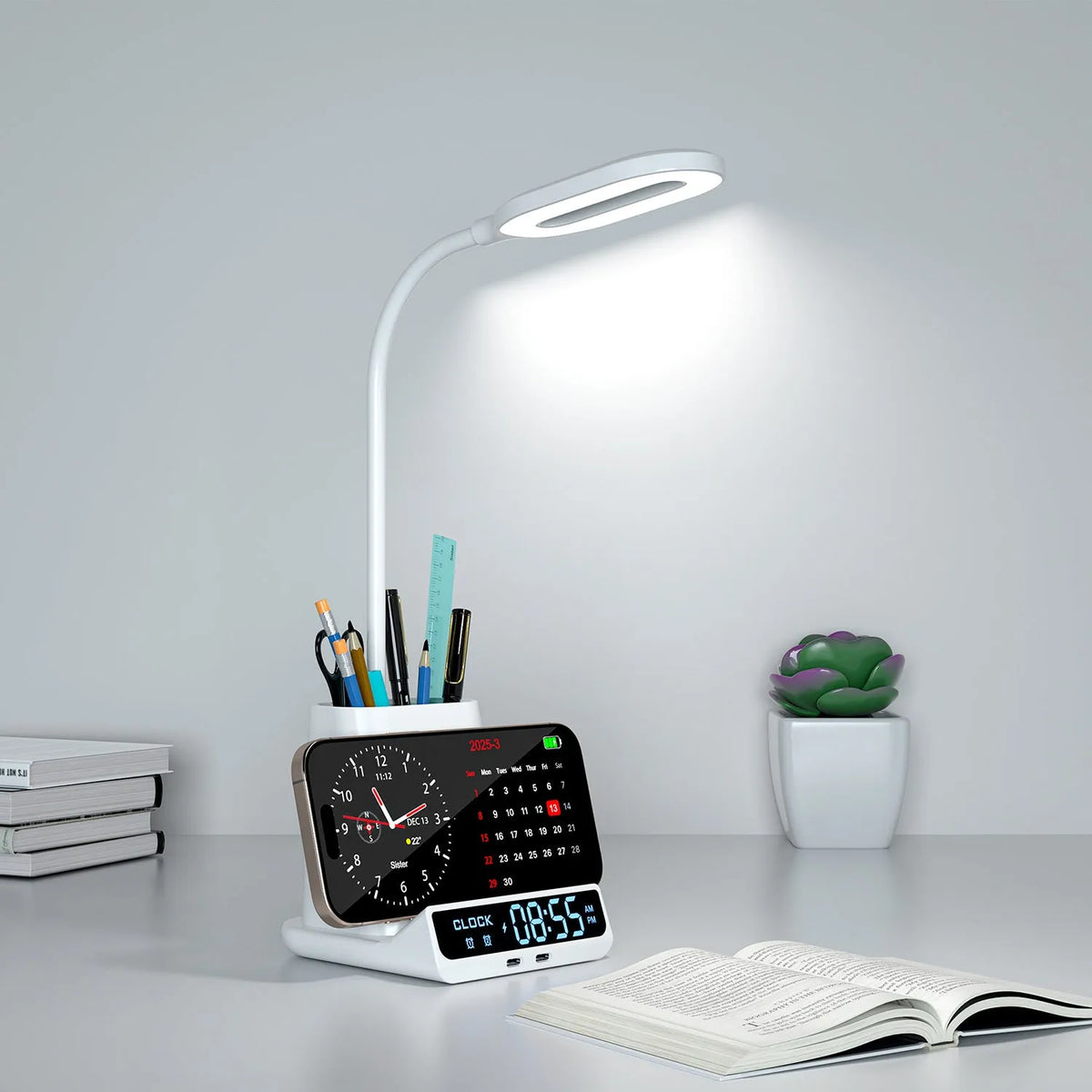 Modern black and white wireless charging desk lamp with integrated pen holder and storage compartment.
