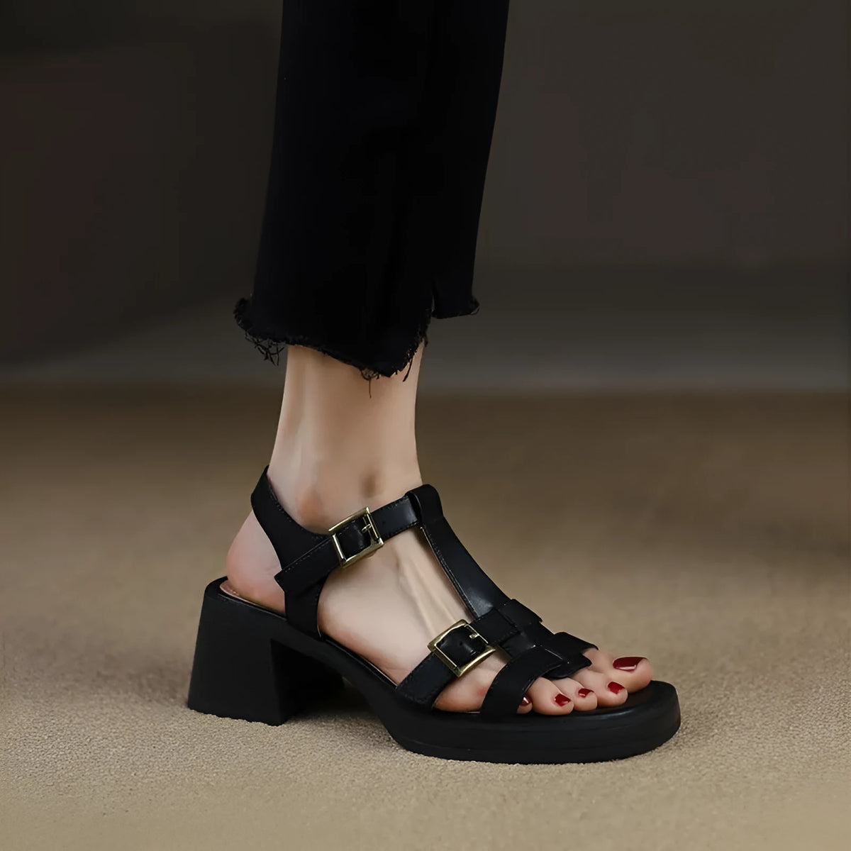 Black retro women's sandals with a T-shaped buckle, open square toe, and a chunky platform heel.