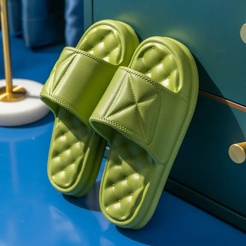 A pair of thick-soled EVA bathroom slippers in a chosen colour, showing the non-slip sole pattern.
