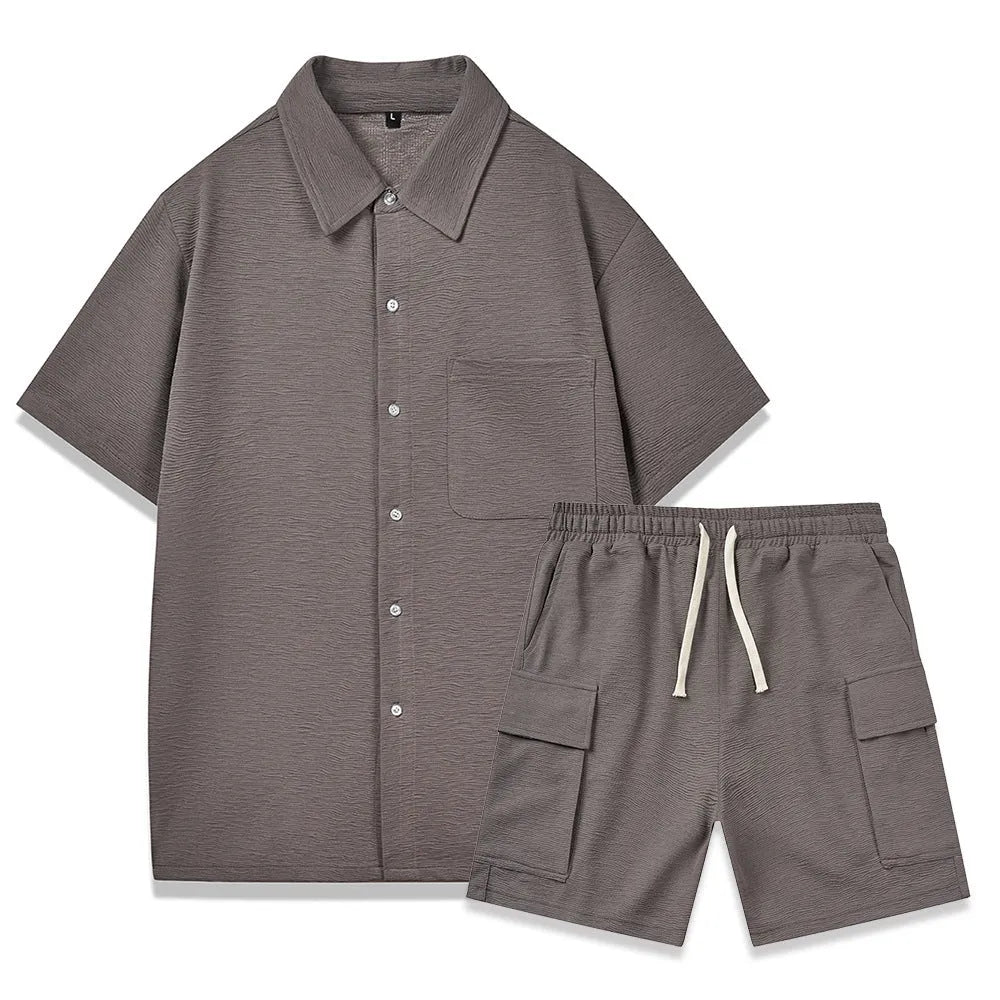 Beige polyester short-sleeve top and elastic waist shorts two-piece set laid flat.