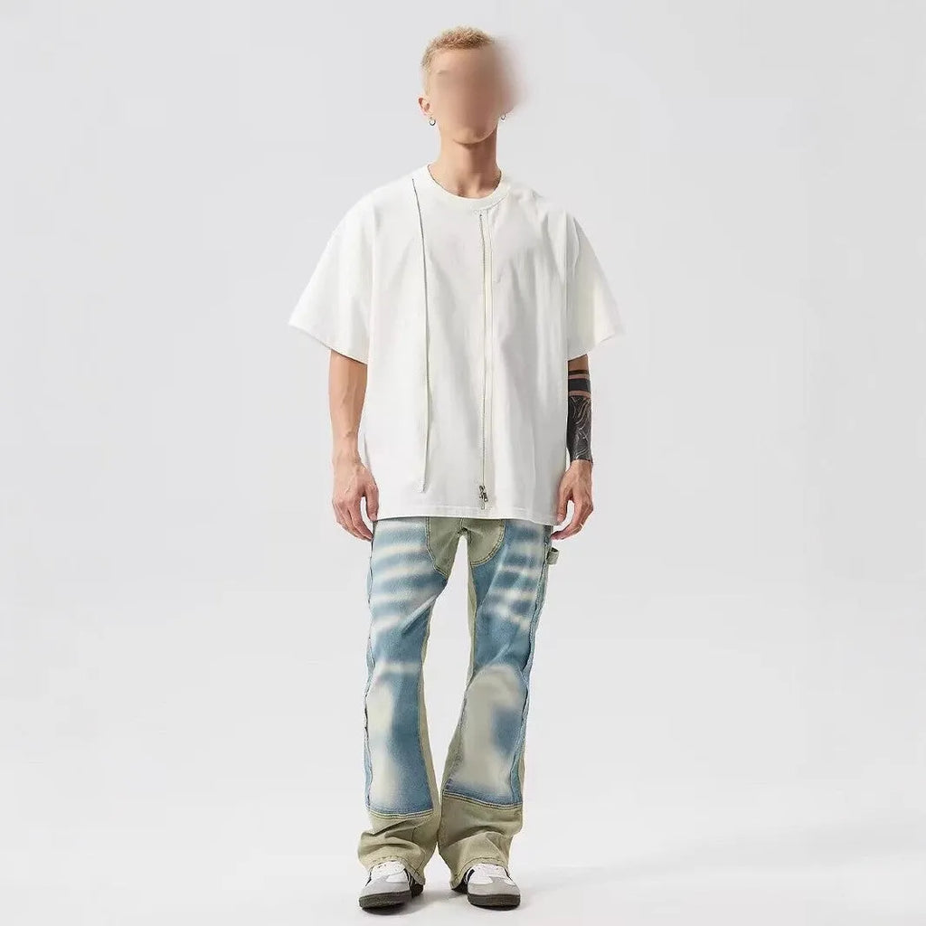 Retro yellow and blue patchwork jeans with splash-ink distressing, mid-waist cut with zip fly