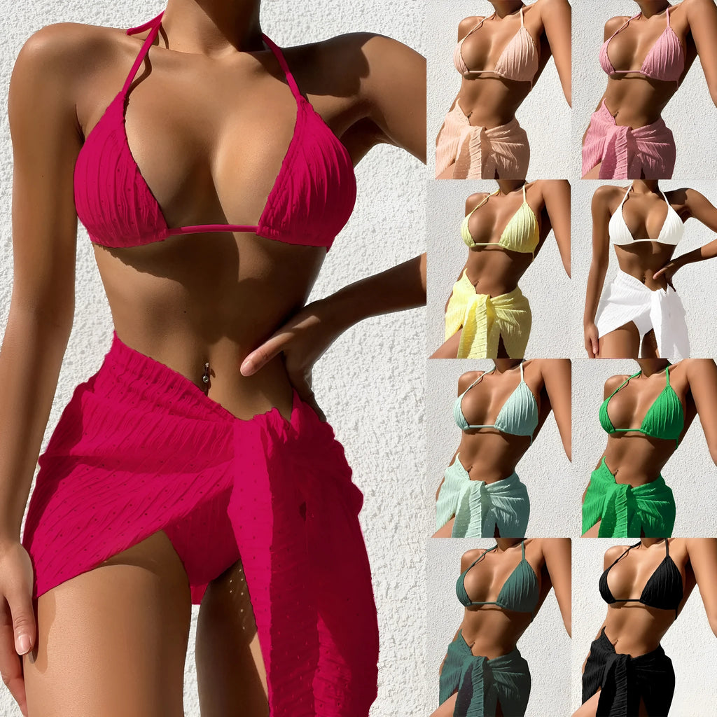 Women's halterneck bikini and mesh skirt swimsuit set in a solid colour.