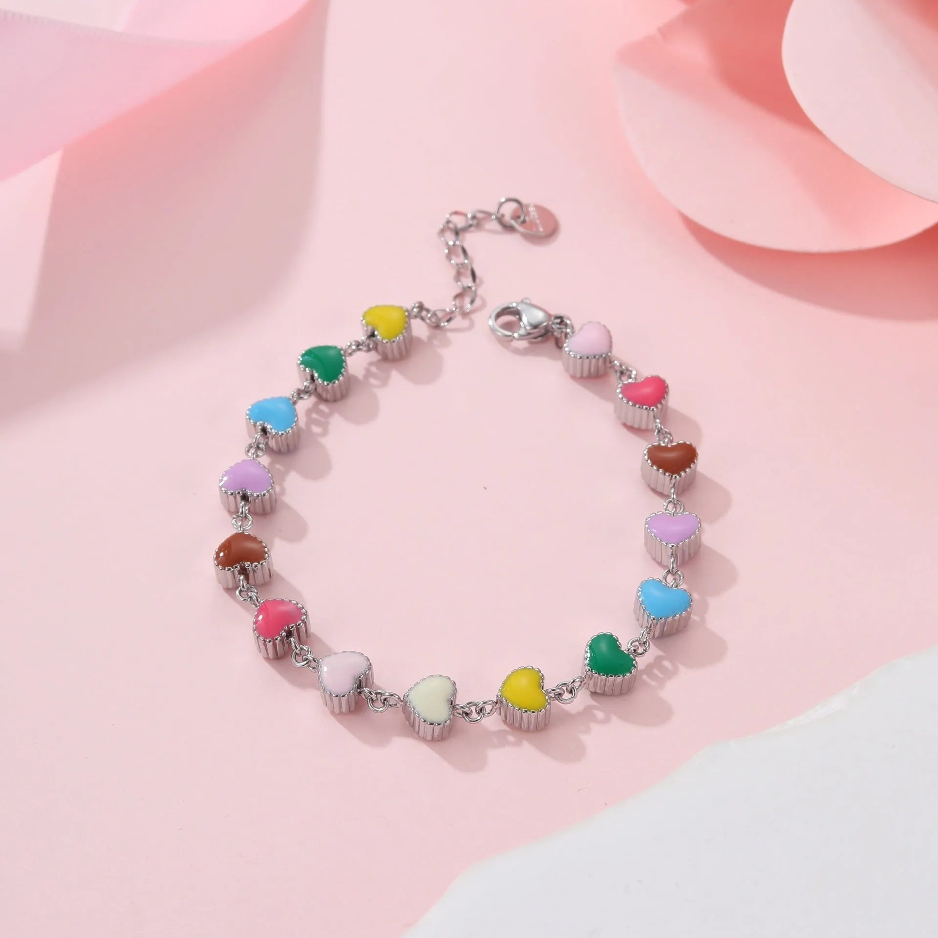 Women's titanium steel bracelet with love heart pendant in gold or steel electroplated finish