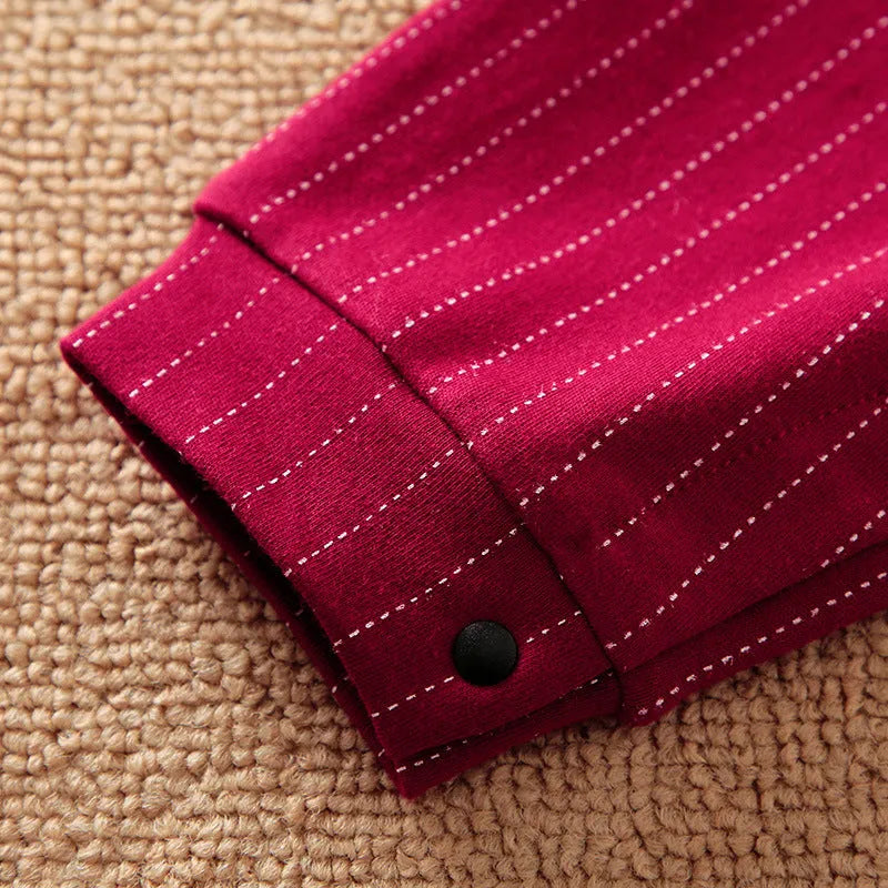 Wine red cotton baby boy romper with long sleeves and single-breasted closure.