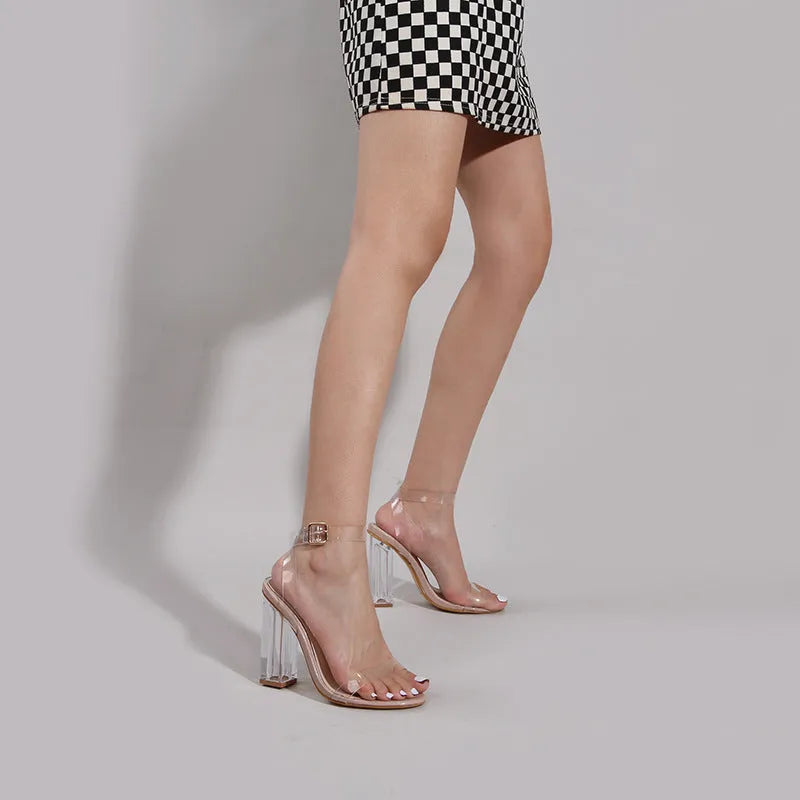 Apricot coloured women's high heel sandals with a round toe and a glass heel, featuring a buckle fastening.